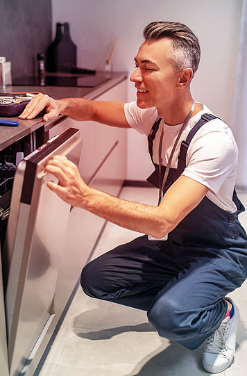 Repair technician working on appliance