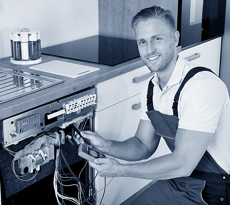 Repair technician servicing appliance